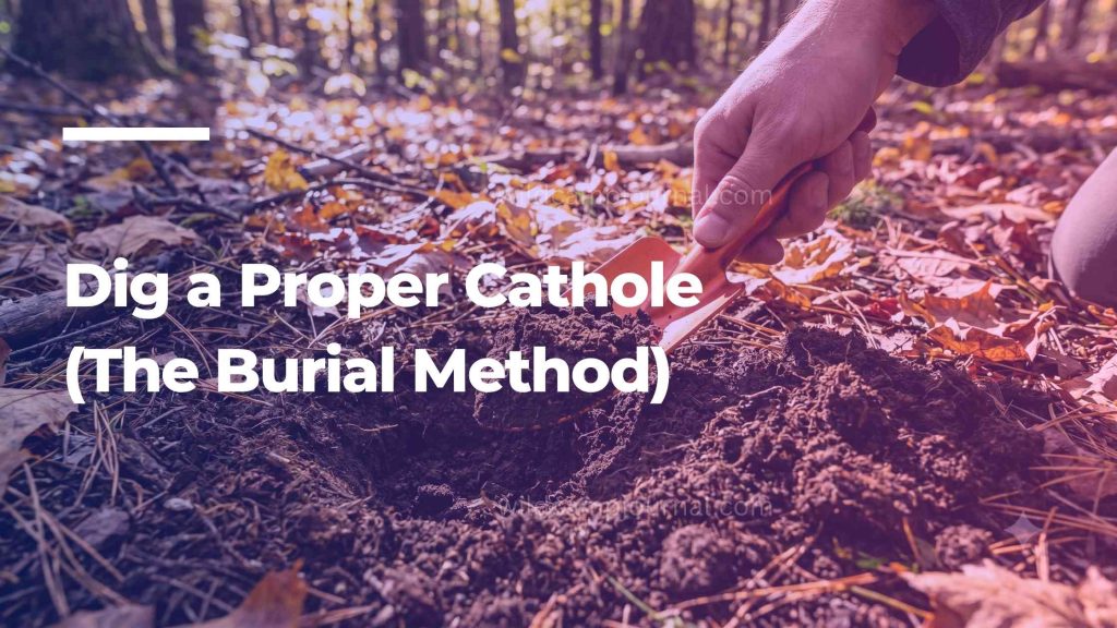 Using a lightweight aluminum backpacking trowel to dig a 6 to 8 inch deep cathole in dark organic soil.
