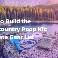 A complete backcountry poop kit featuring an ultralight trowel, hand sanitizer, and WAG bag laid out on a rock overlooking a beautiful mountain lake.