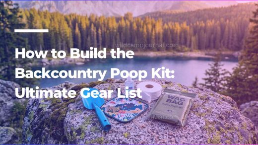 A complete backcountry poop kit featuring an ultralight trowel, hand sanitizer, and WAG bag laid out on a rock overlooking a beautiful mountain lake.