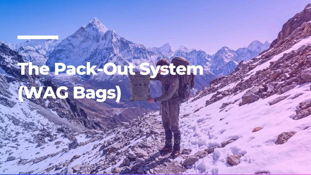 Hiker holding a WAG bag pack-out system in a rocky alpine environment where digging a cathole is not permitted.
